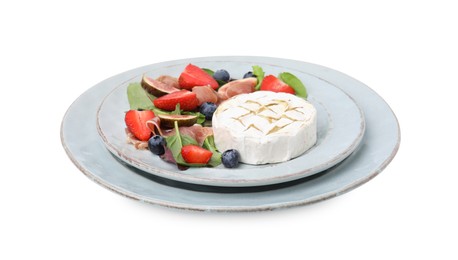 Delicious salad with brie cheese, prosciutto, strawberries and blueberries on white background