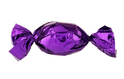 Photo of Candy in purple wrapper isolated on white