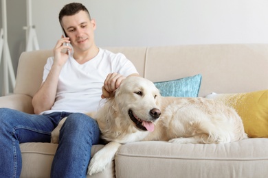 Portrait of owner with his friendly dog at home