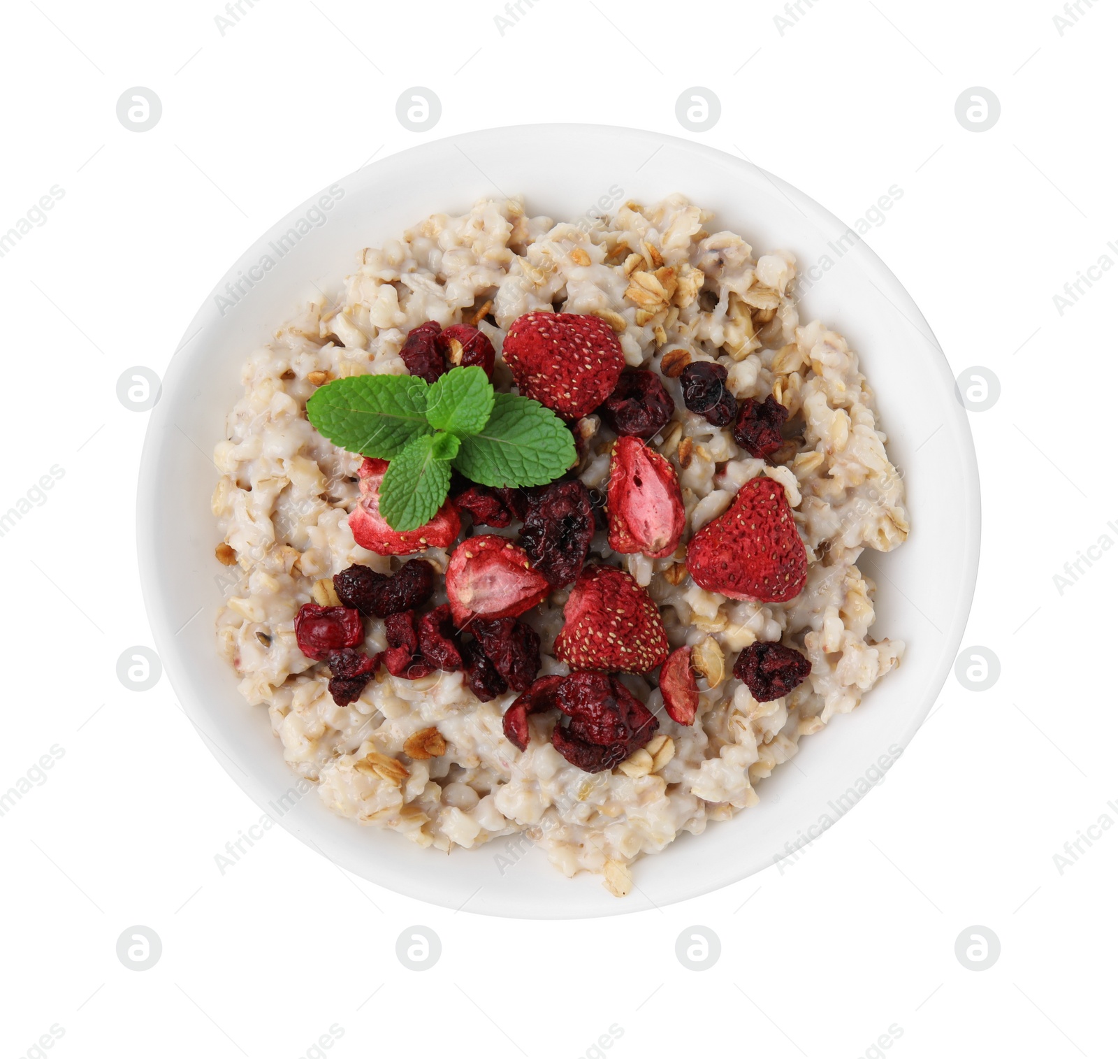 Photo of Oatmeal with freeze dried strawberries and mint isolated on white, top view