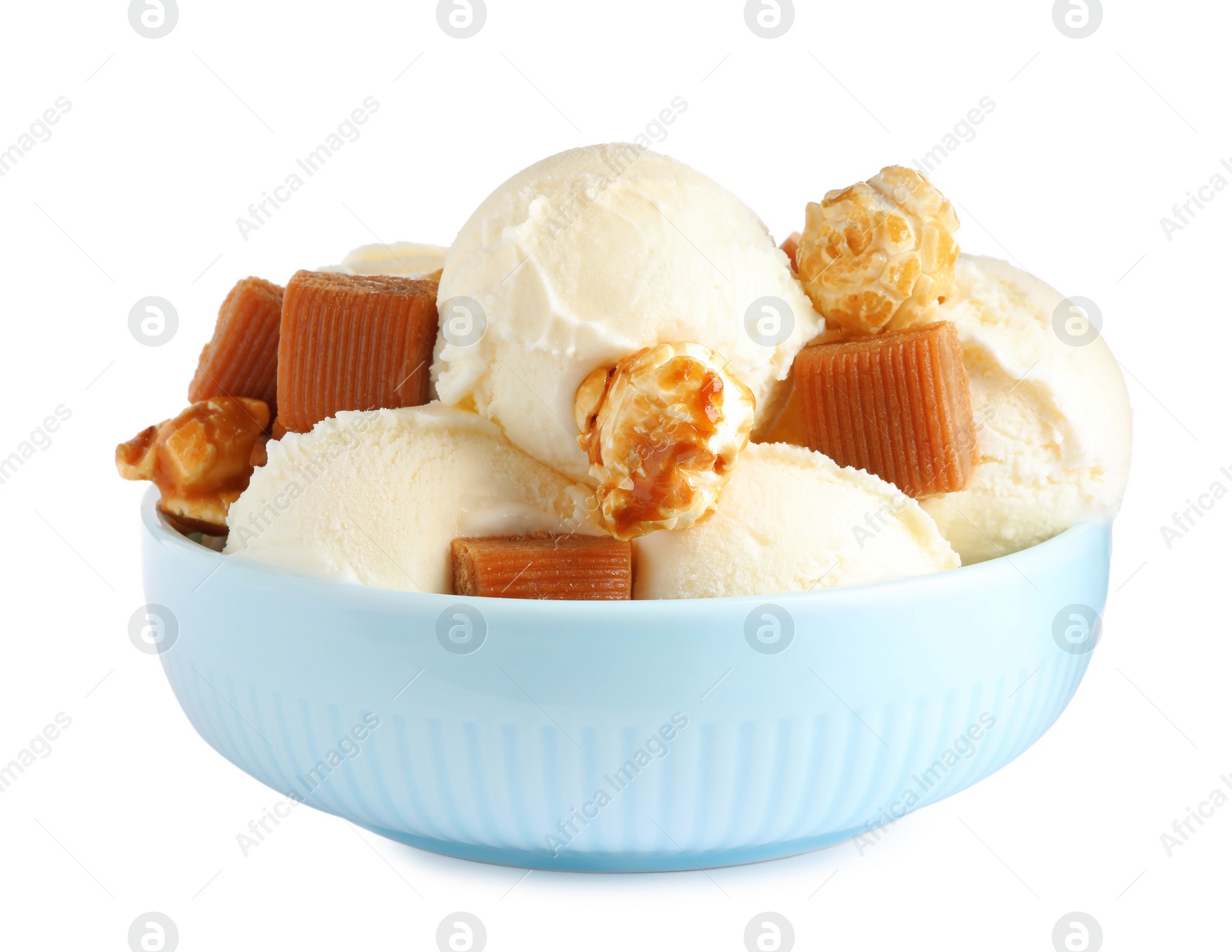 Photo of Plate of delicious ice cream with caramel candies and popcorn on white background