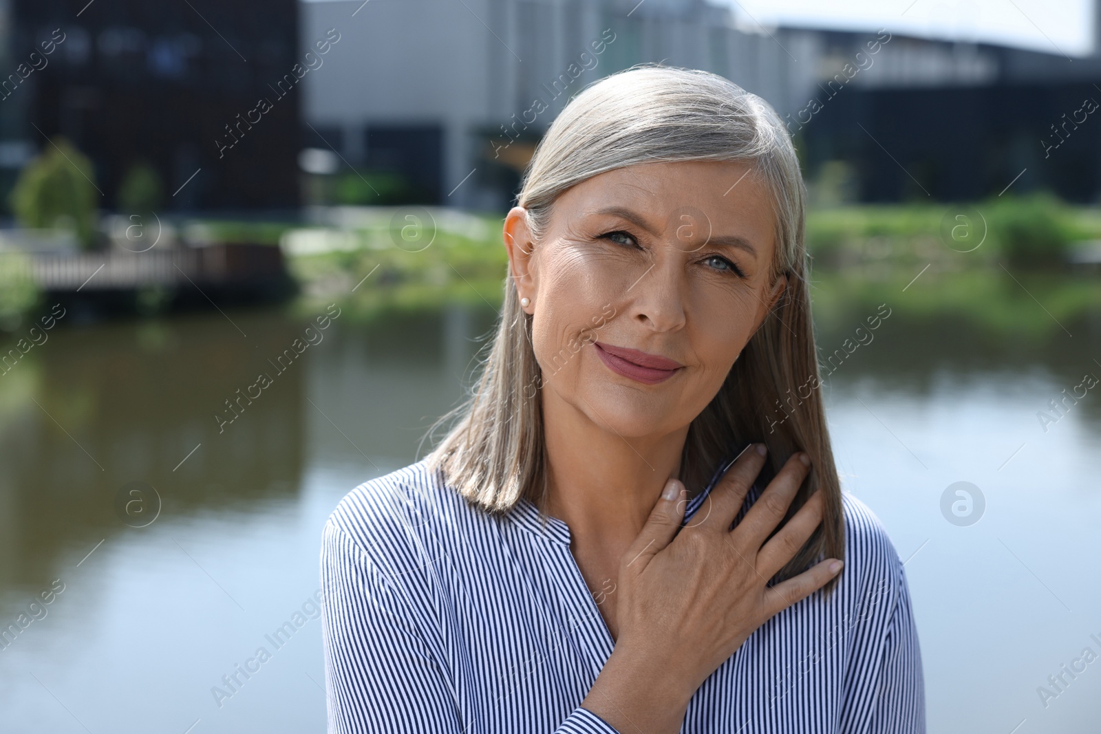 Photo of Portrait of beautiful smiling senior woman outdoors