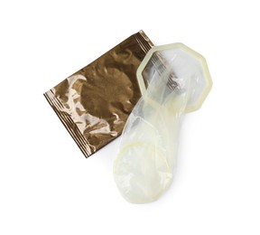 Photo of Unrolled female condom and package isolated on white, top view. Safe sex
