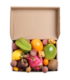 Cardboard box with different exotic fruits on white background, top view