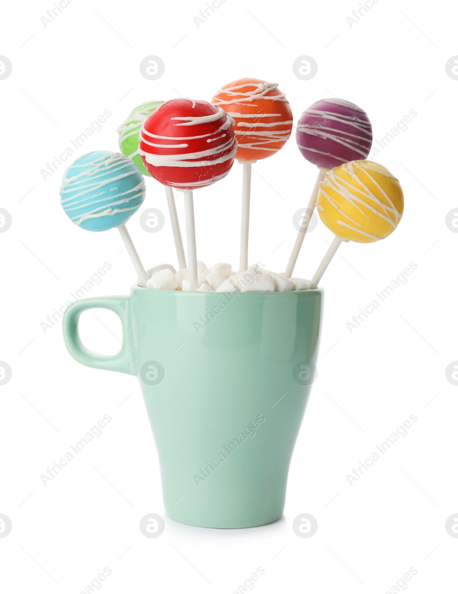 Photo of Delicious colorful cake pops in cup on white background