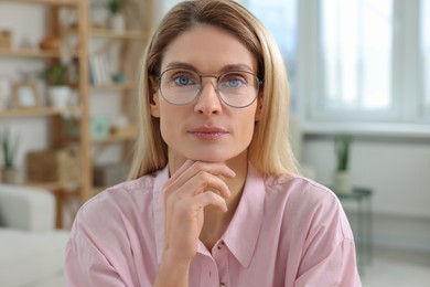 Woman having video call at home, view from web camera