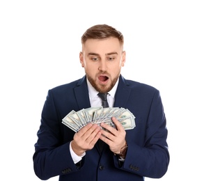 Portrait of young businessman holding money banknotes on white background