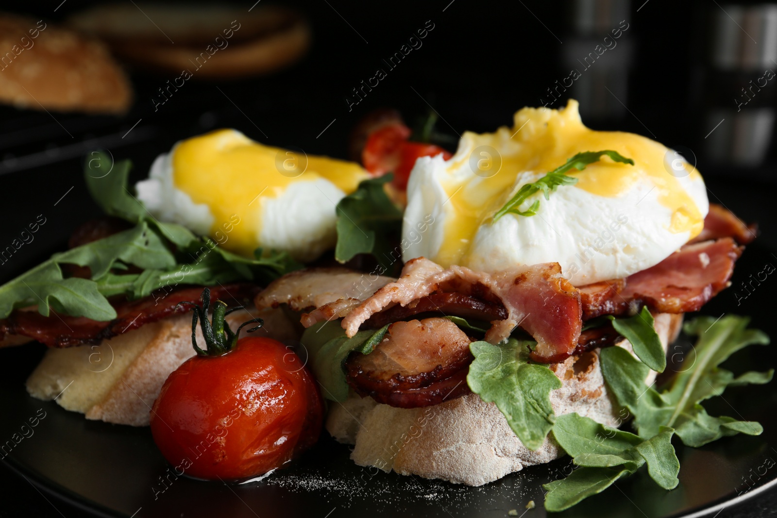 Photo of Delicious eggs Benedict served on plate, closeup
