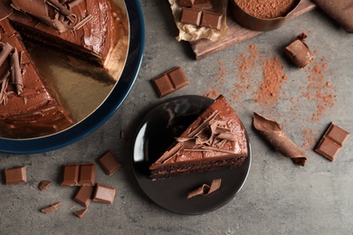 Flat lay composition with tasty chocolate cake on table