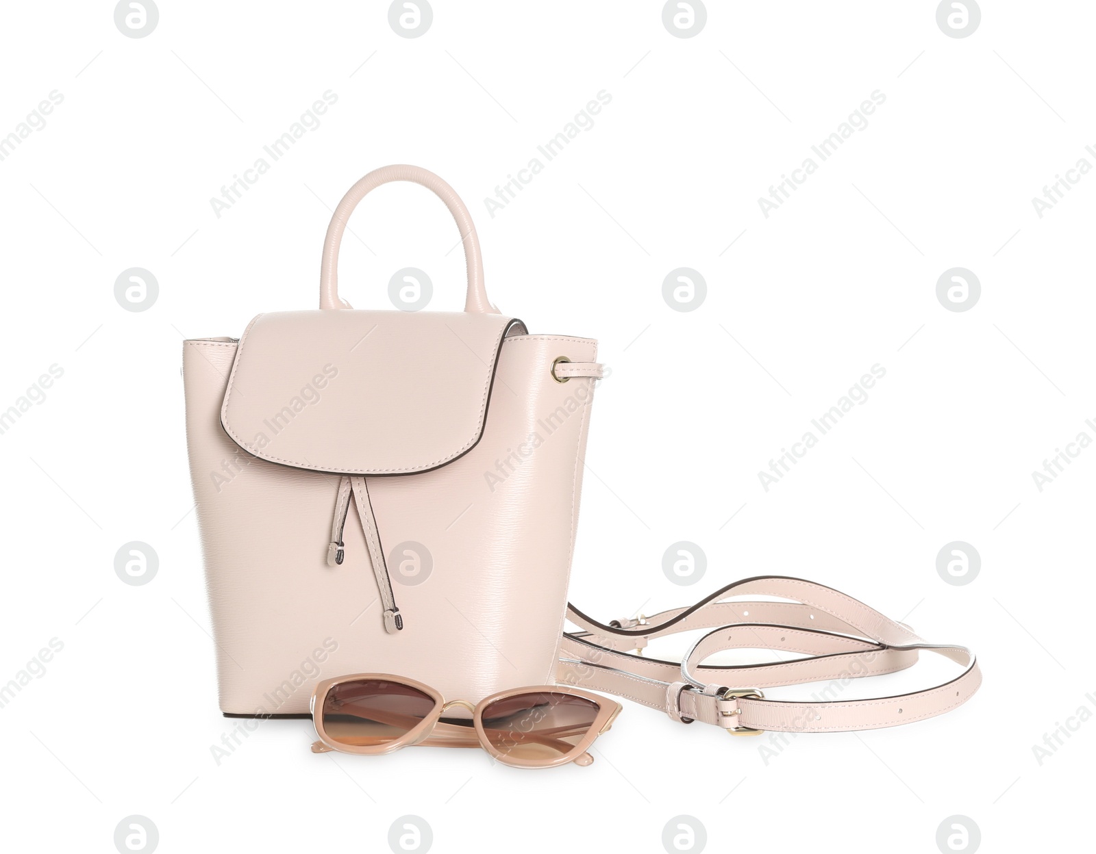 Photo of Stylish woman's backpack and sunglasses isolated on white
