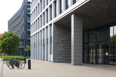 Photo of Beautiful view of modern building and bicycle stands