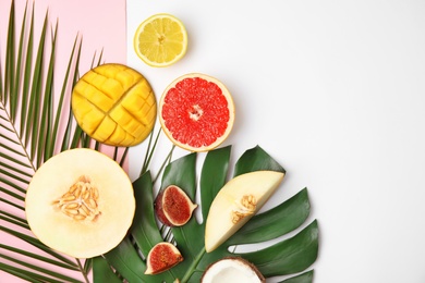 Photo of Flat lay composition with melon, other fruits and space for text on color background