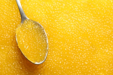 Photo of Fresh pike caviar and spoon, closeup. Space for text