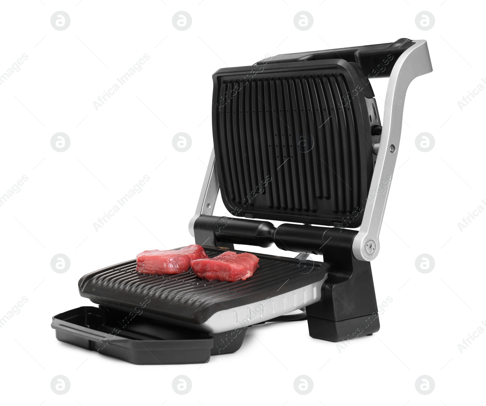 Photo of Electric grill with raw meat steaks isolated on white