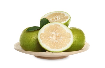 Photo of Whole and cut sweetie fruits with green leaves on white background