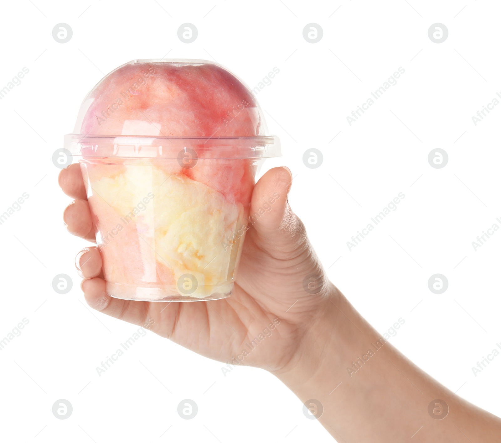 Photo of Woman holding plastic cup with yummy cotton candy on white background, closeup