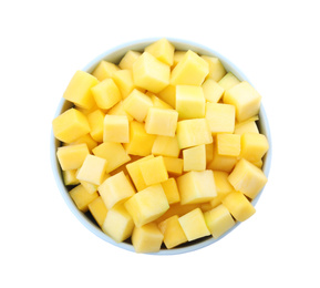 Photo of Tasty mango cubes in ceramic bowl isolated on white, top view