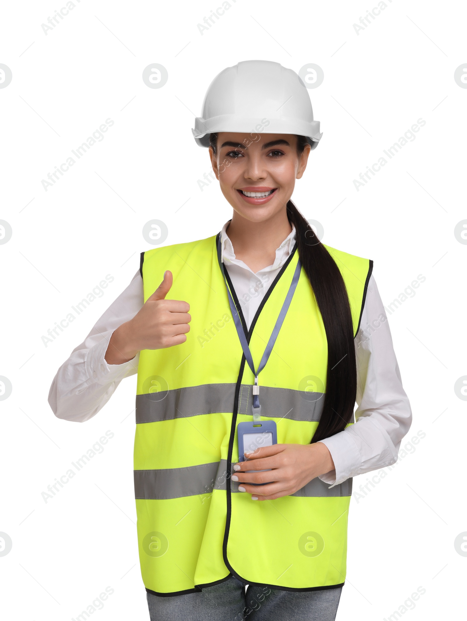 Photo of Engineer with hard hat and badge showing thumb up on white background