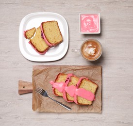 Photo of Cut tasty sweet cake and aromatic coffee on wooden table, flat lay