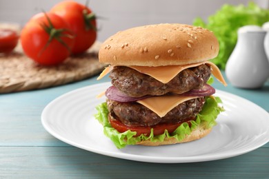 Photo of Tasty hamburger with patties, cheese and vegetables on light blue wooden table