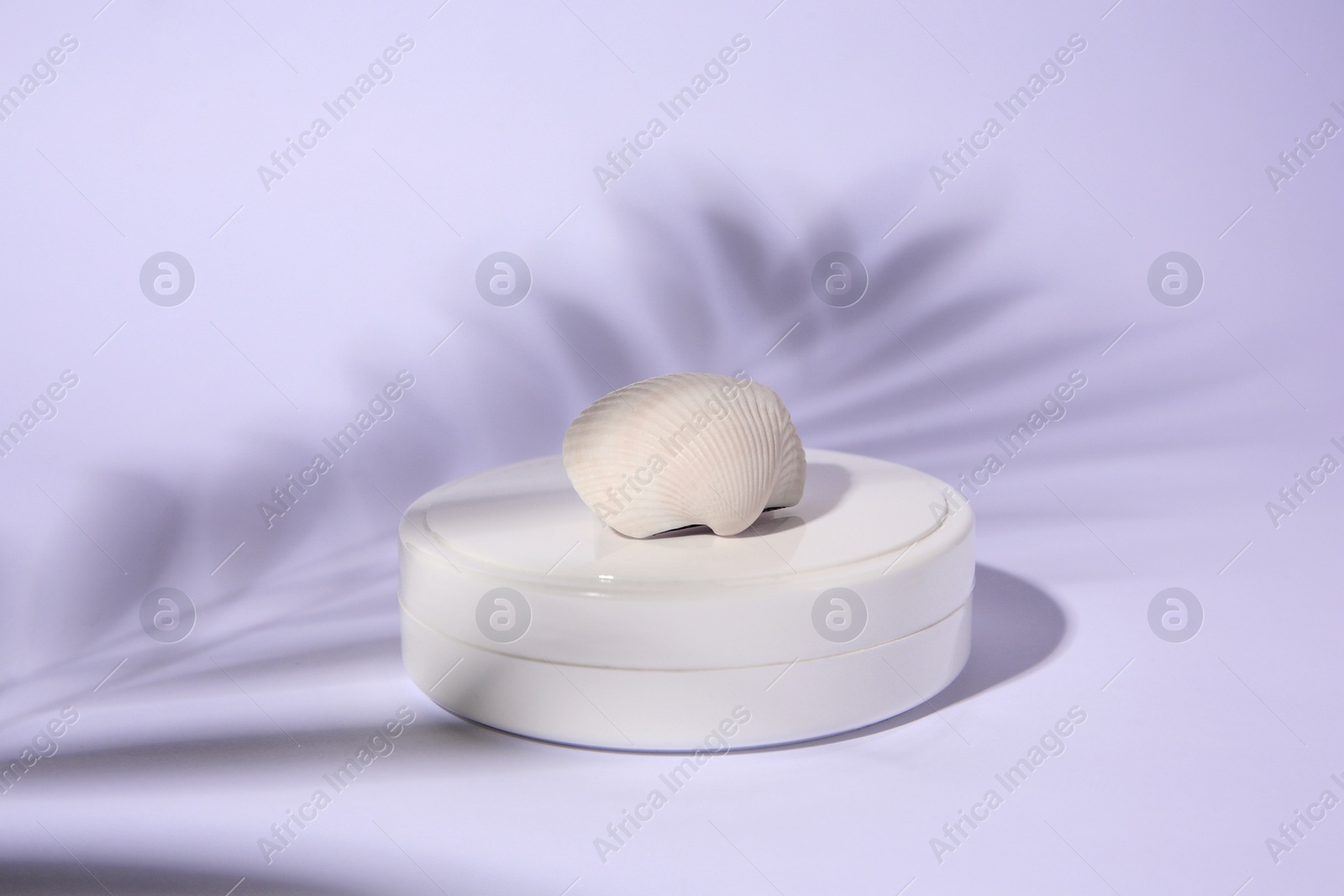 Photo of Cosmetic product, shell and shadow of tropical leaf on white background