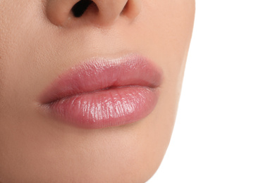 Woman with beautiful full lips on white background, closeup