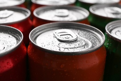 Photo of Energy drink in wet cans, closeup. Functional beverage