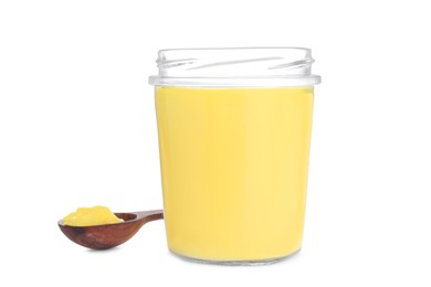 Glass jar and spoon of Ghee butter isolated on white