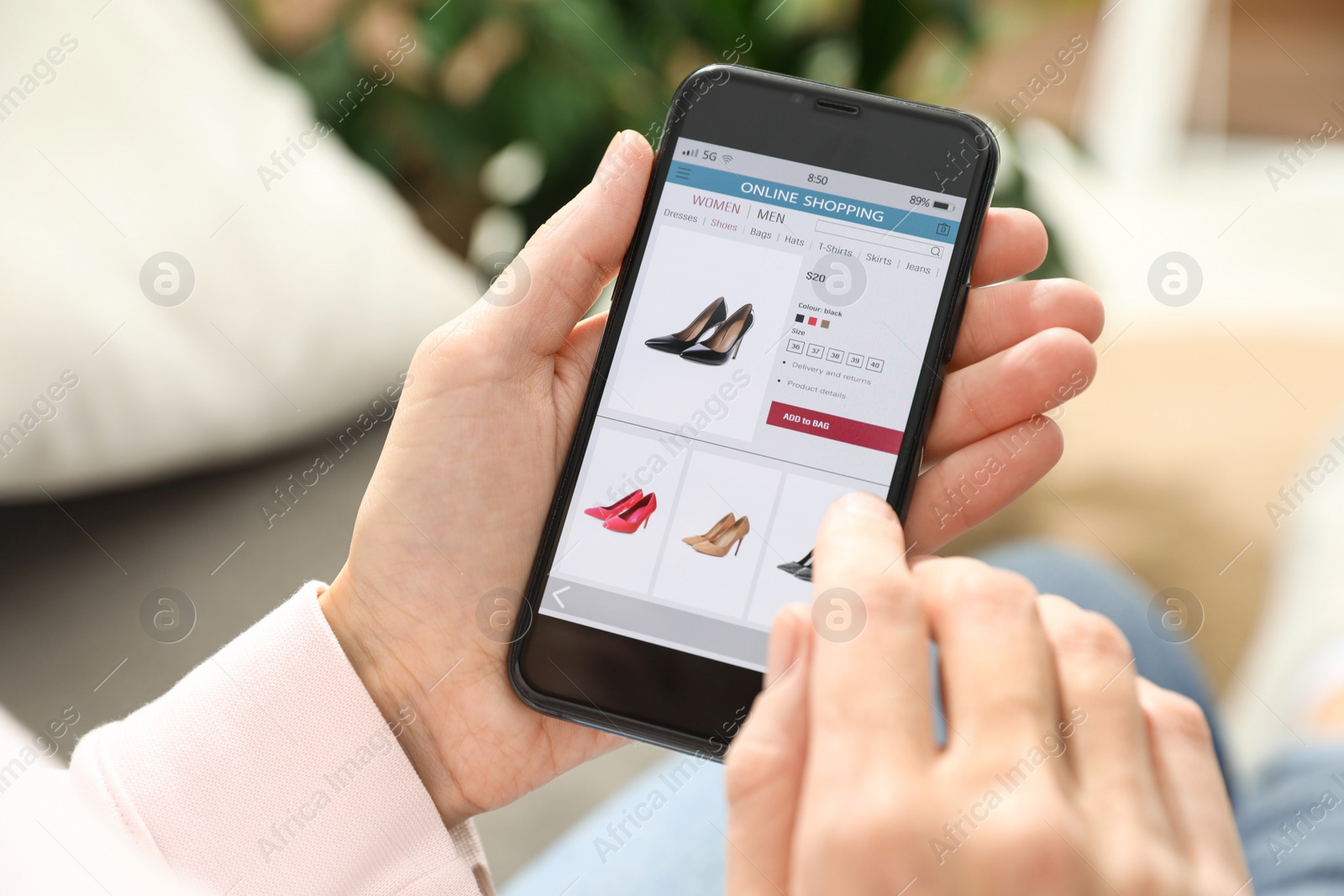 Photo of Woman using smartphone for online shopping indoors, closeup