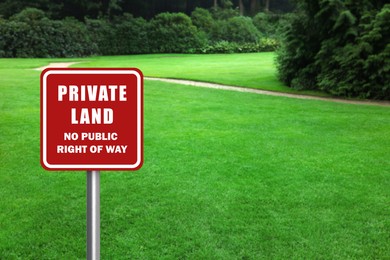 Image of Sign with text Private Land No Public Right Of Way on green lawn