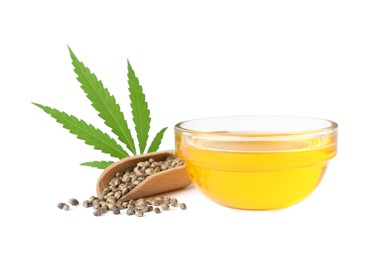 Bowl of hemp oil, fresh leaf and seeds on white background