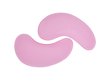 Pink under eye patches on white background, top view. Cosmetic product