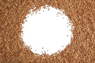 Photo of Uncooked buckwheat and space for text on white background, top view