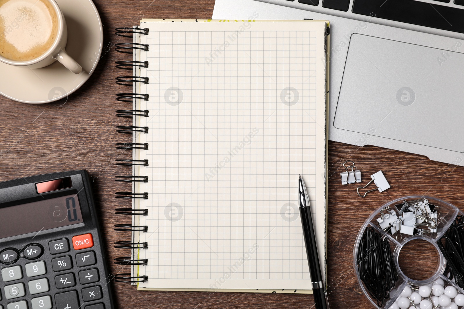 Photo of Flat lay composition with empty notebook on wooden table