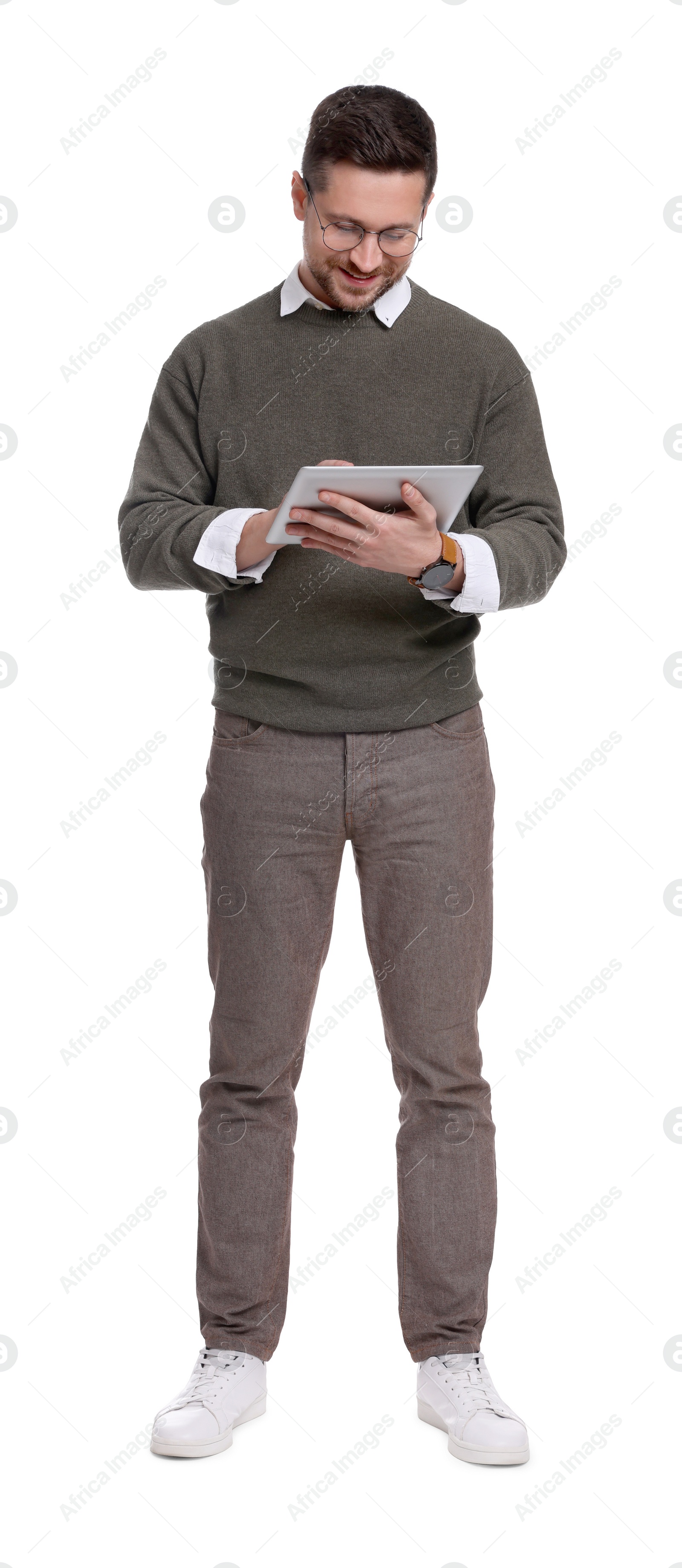 Photo of Handsome bearded businessman in eyeglasses using tablet on white background