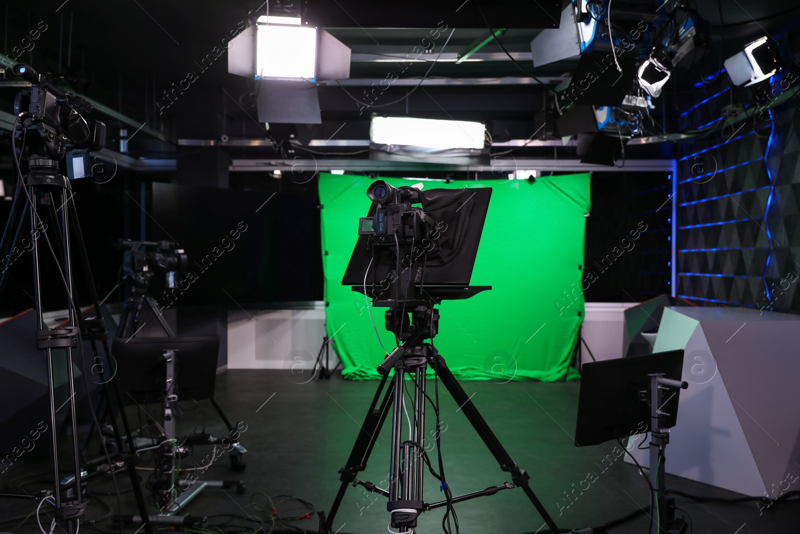 Photo of Modern video recording studio with professional cameras