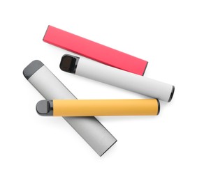 Photo of Many disposable electronic smoking devices on white background, top view
