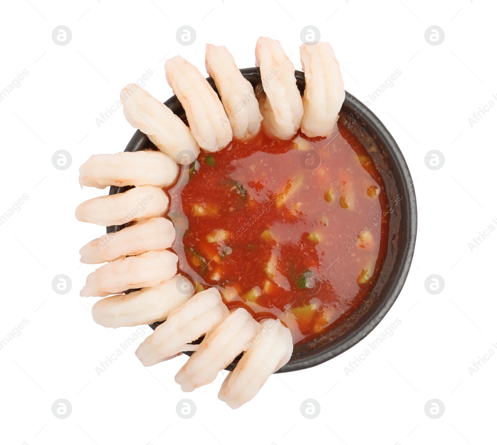 Photo of Tasty shrimp cocktail with sauce isolated on white, top view