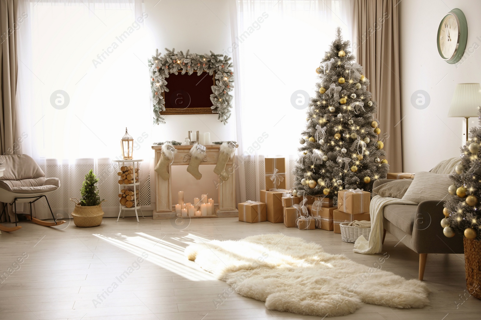 Photo of Stylish Christmas interior with beautiful decorated tree and fireplace