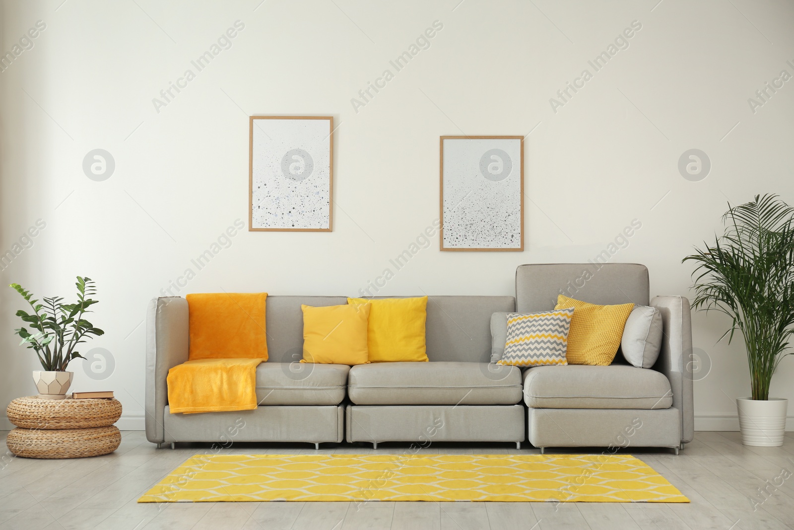 Photo of Stylish living room interior with comfortable grey sofa