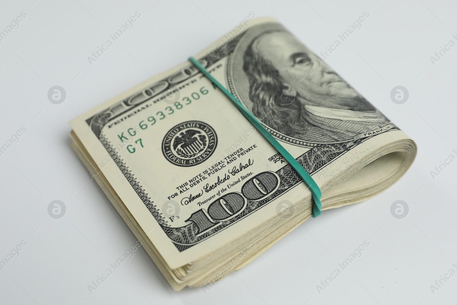 Photo of Money exchange. Dollar banknotes on white background, closeup