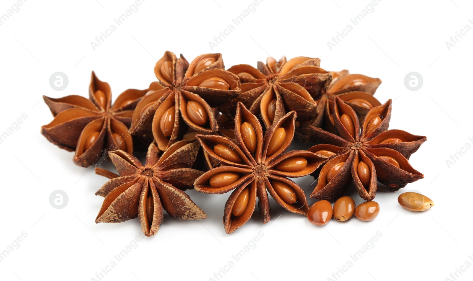 Photo of Dry anise stars with seeds on white background