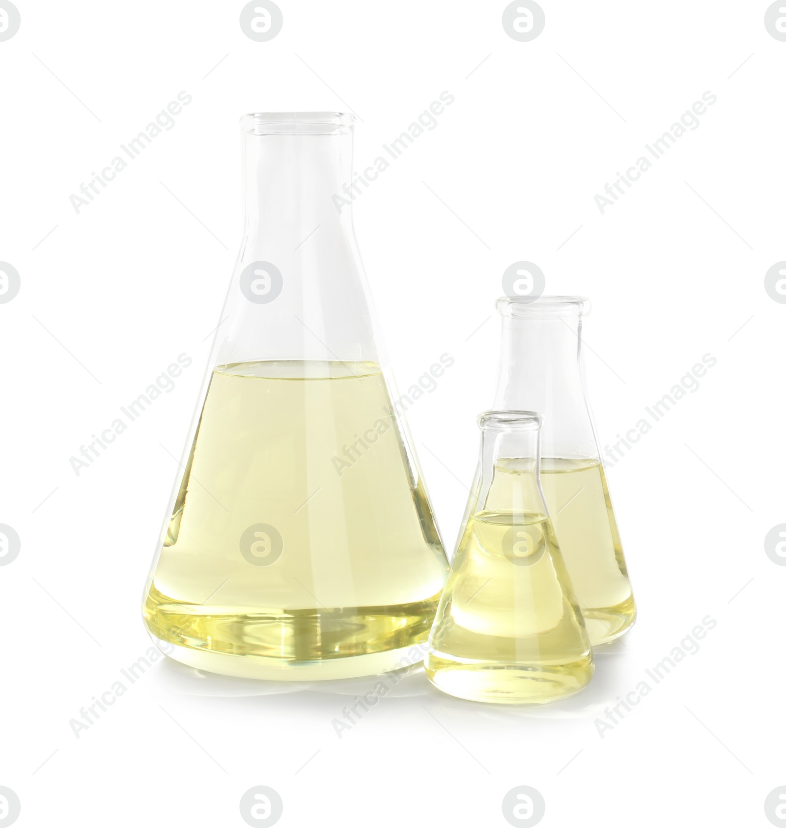 Photo of Laboratory glassware with liquid on white background. Chemical analysis