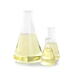 Laboratory glassware with liquid on white background. Chemical analysis