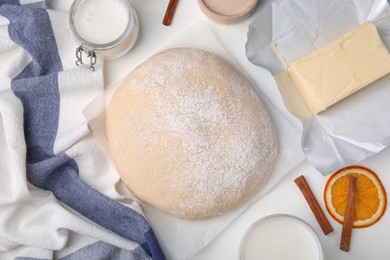 Photo of Fresh dough and ingredients on white table, flat lay
