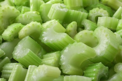 Fresh green cut celery as background, closeup