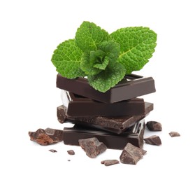 Tasty dark chocolate pieces with mint on white background