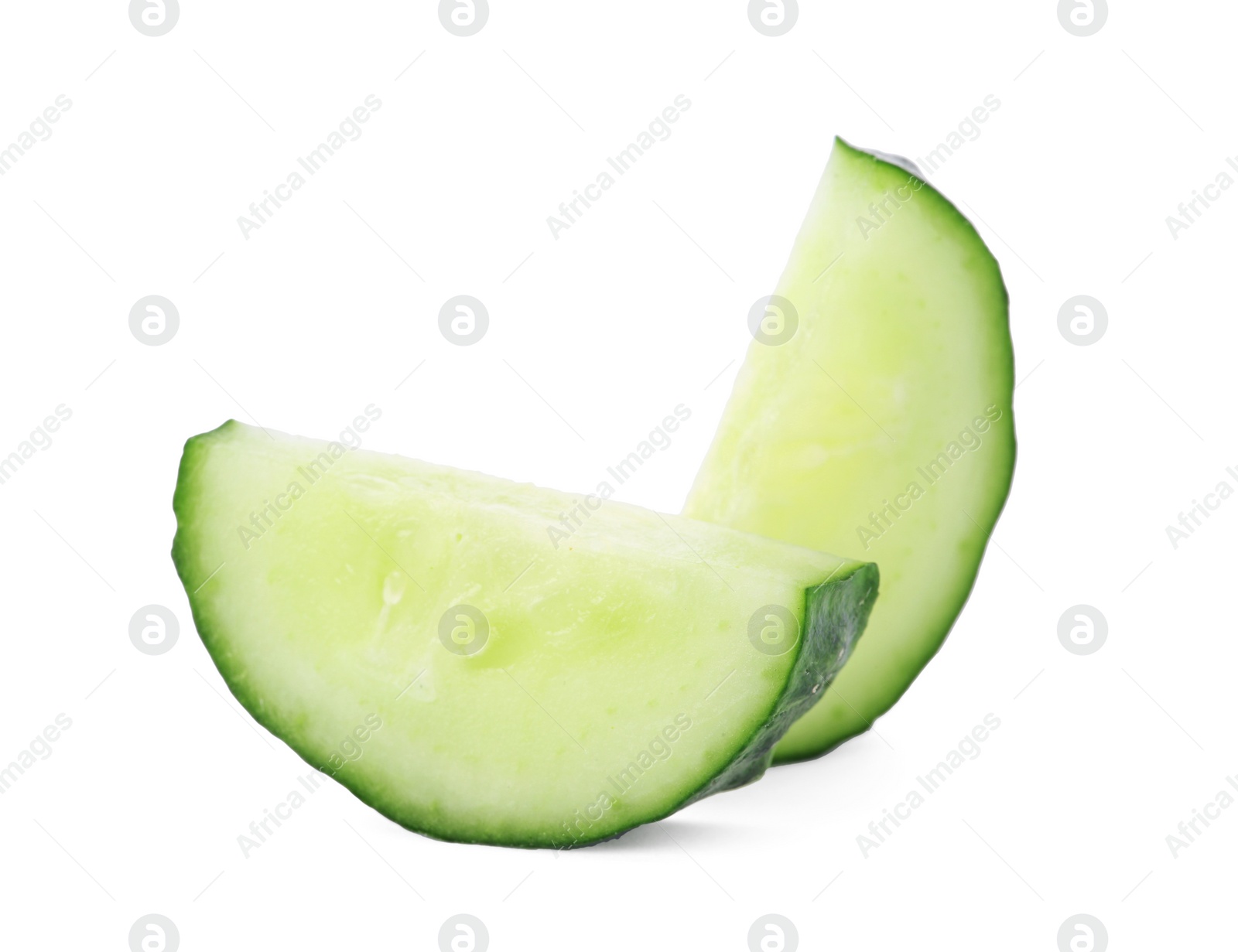 Slices of fresh cucumber on white background Photo of Slices of fresh cucumber on white background