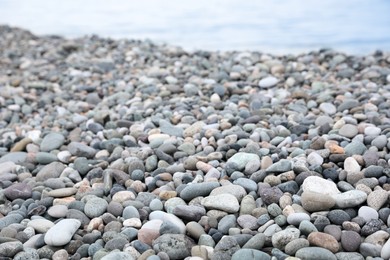 Picturesque view of beach with pebbles near sea