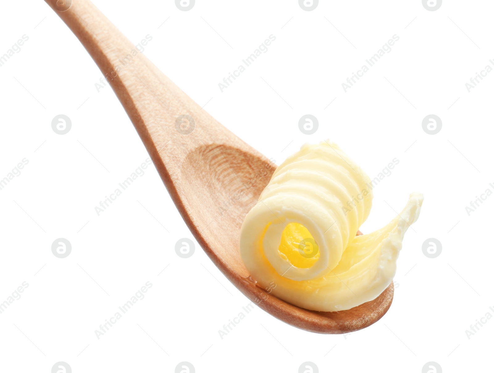 Photo of Wooden spoon with butter curl on white background